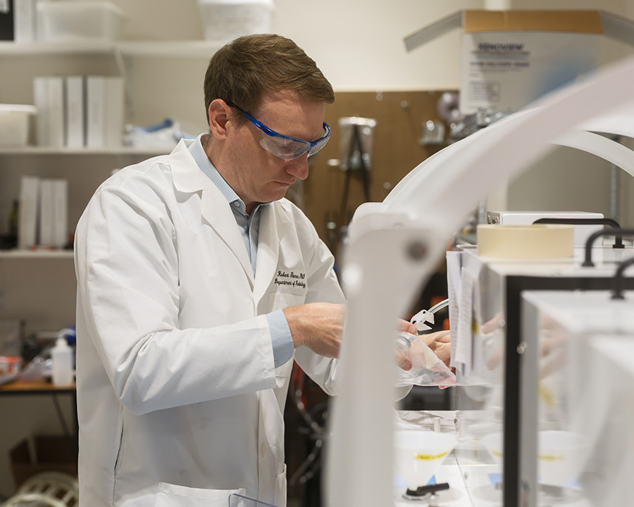 Robert Thomen in the lab, hyperpolarizing xenon gas