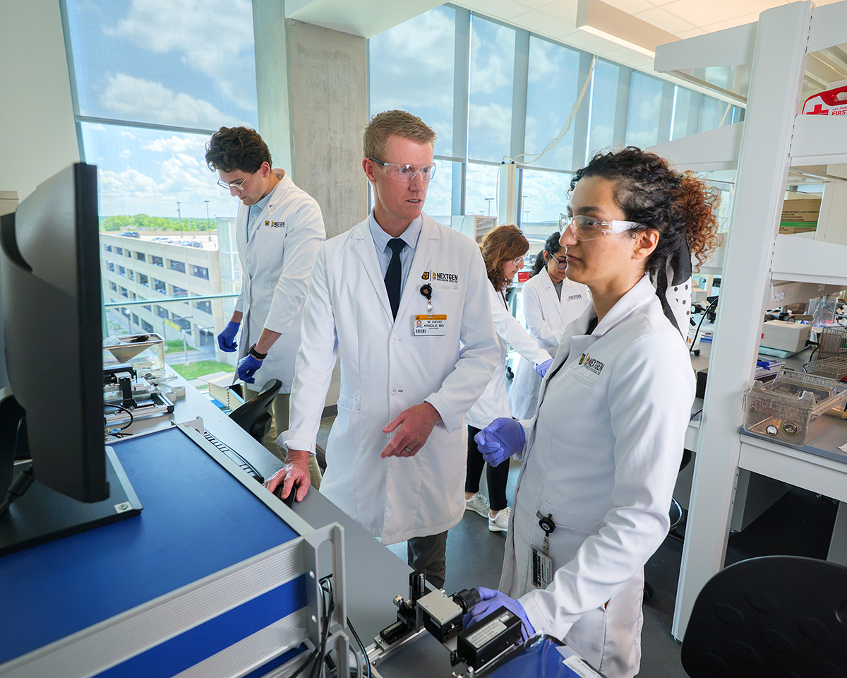 David Arnold in the lab with his team