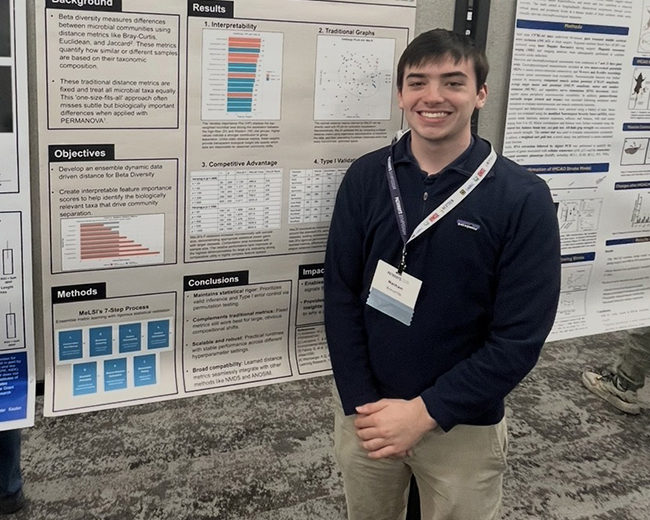 Nathan Bresette at a poster presentation