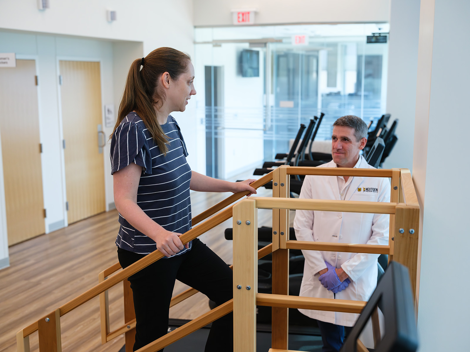 Dr. Moss ascends rehab stairs in the exercise space of the Clinical and Translational Science Unit.