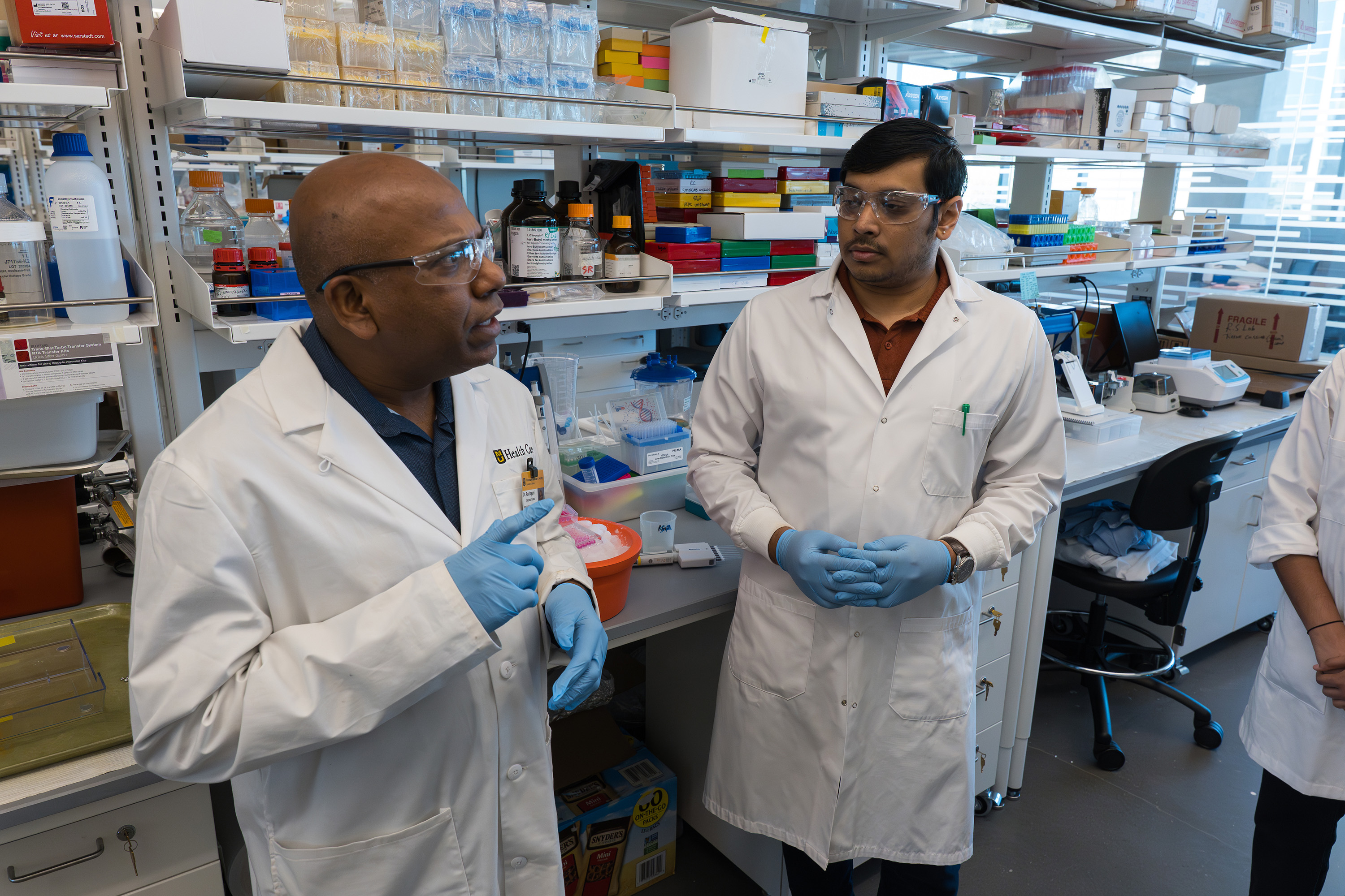 Satyanarayana Rachagani and postdoctoral fellow Nagabhishek Sirpu Natesh in the lab.